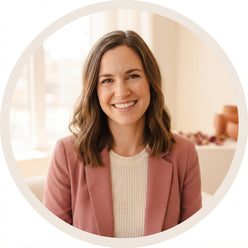 Portrait of influencer Amanda Hirsch smiling against a soft, neutral background.