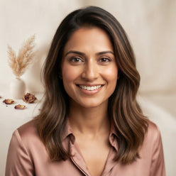 A professional portrait of an influencer smiling, used to represent a trusted customer review on a wedding planning website.
